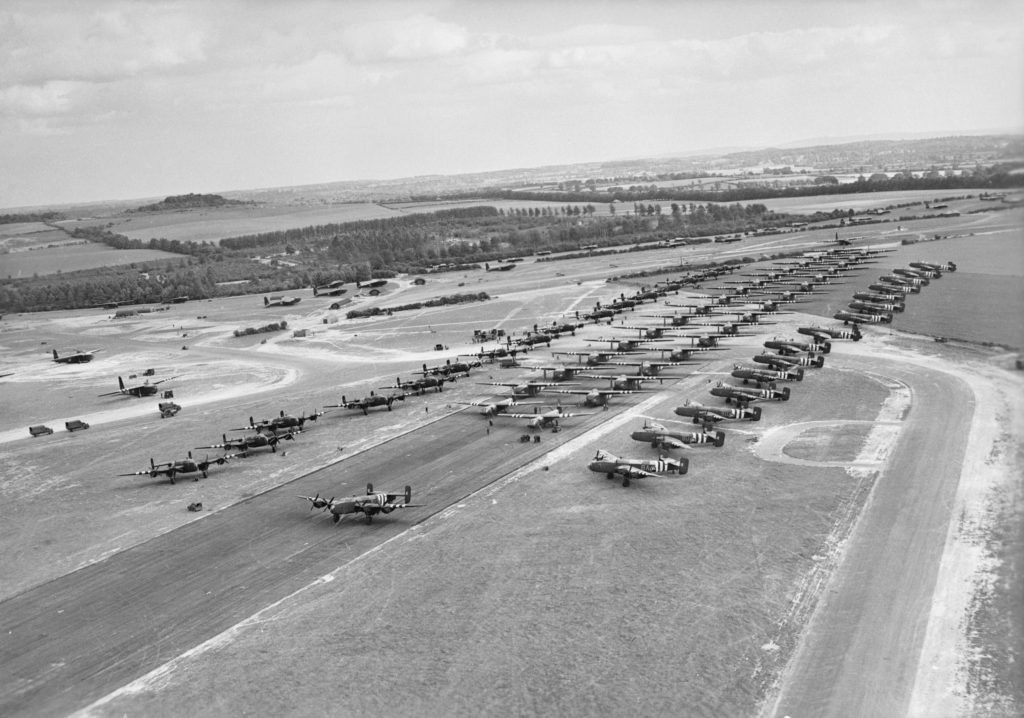 Handley Page Halifax glider-tugs along with Horsa and Hamilcar gliders waiting RAF Tarrant Rushton to take off for Normandy